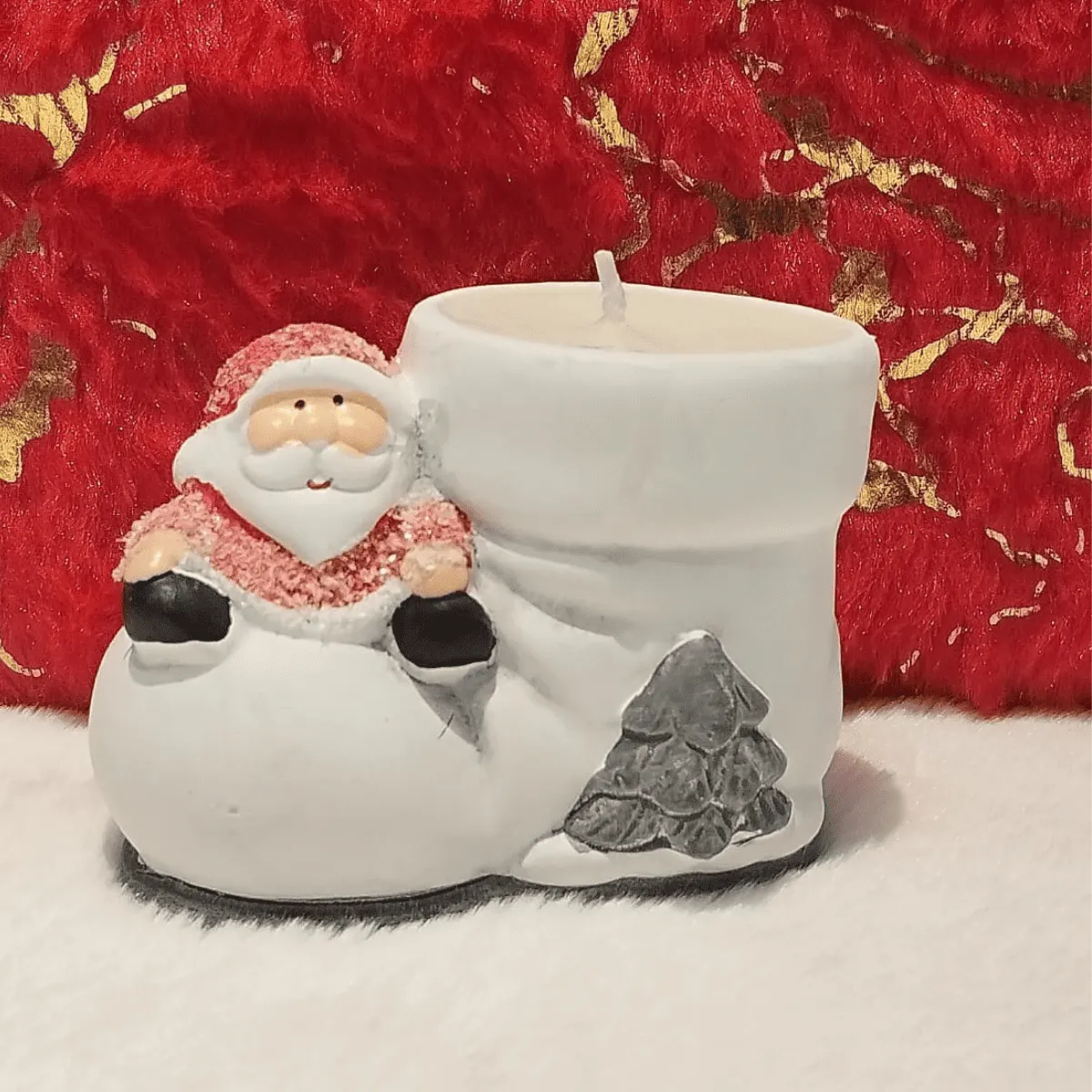 Adorable Santa boot candle for decor.