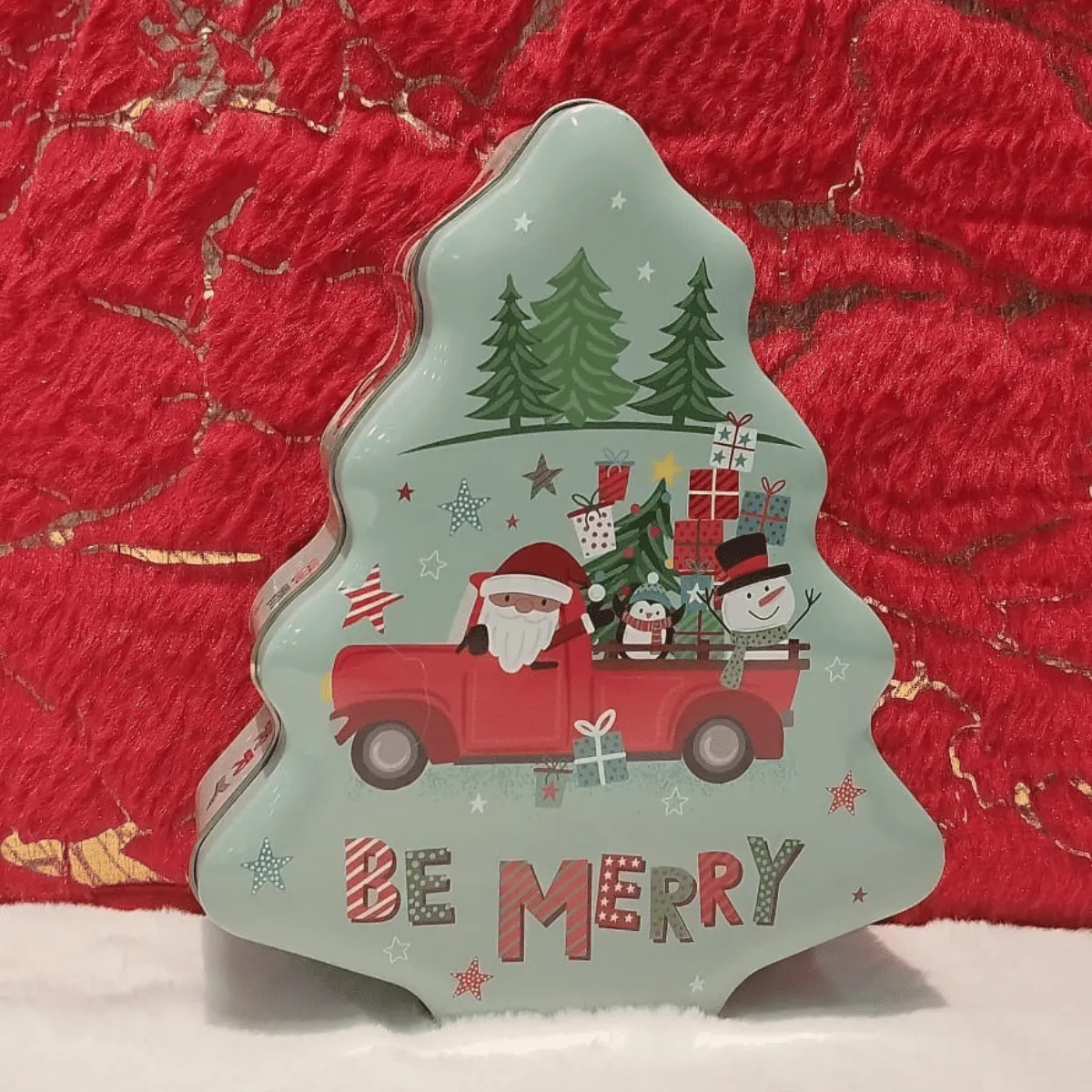 Cheerful Christmas tree shaped gift tin.