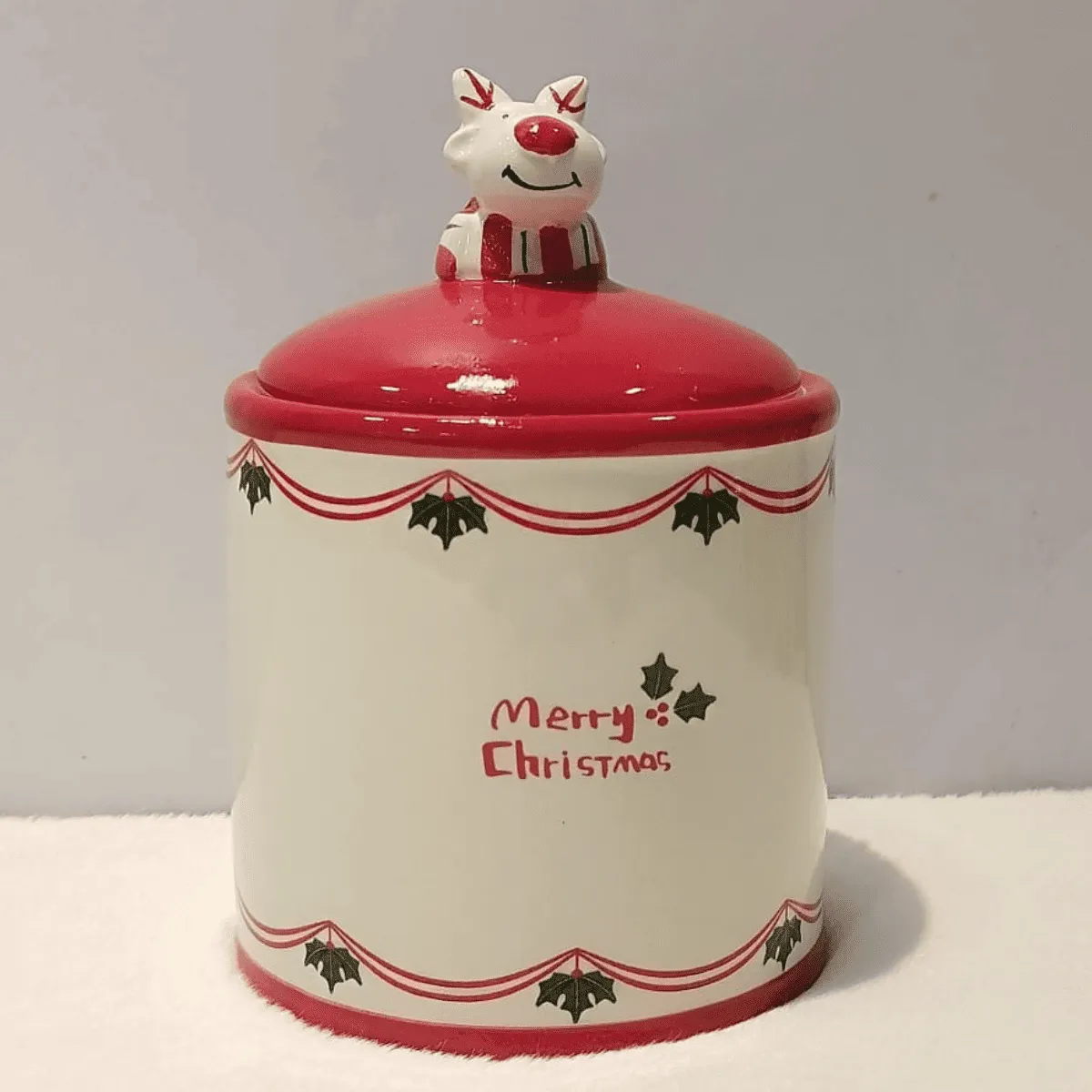 Festive Christmas cookie jar with reindeer.