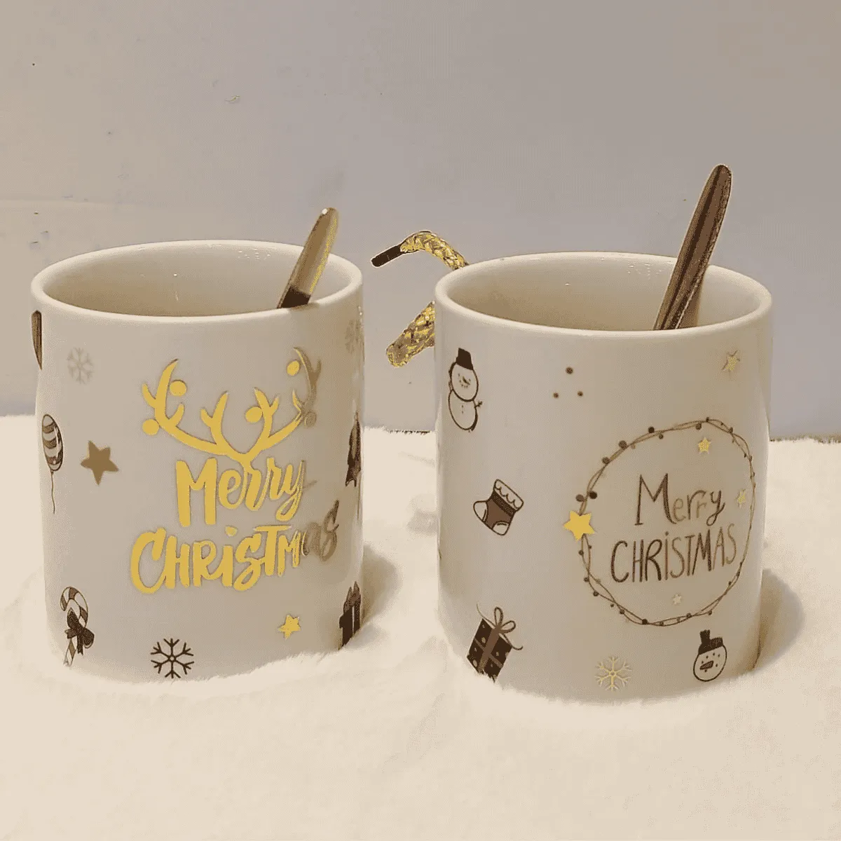 Joyful Christmas mugs with festive designs.