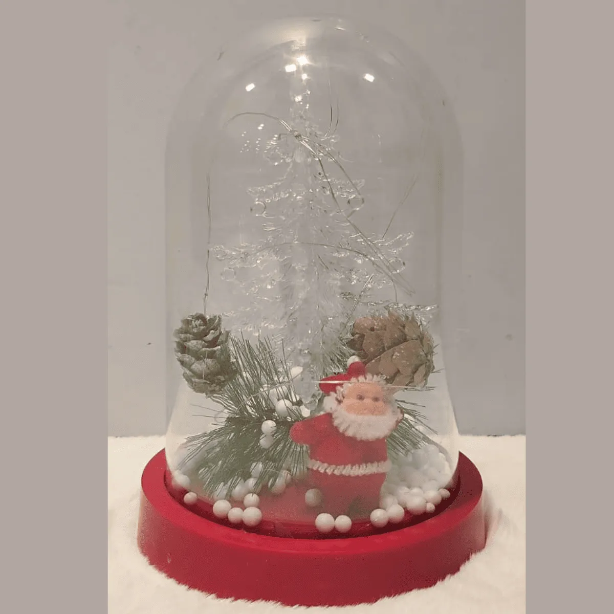 Snow globe featuring Santa and winter decorations