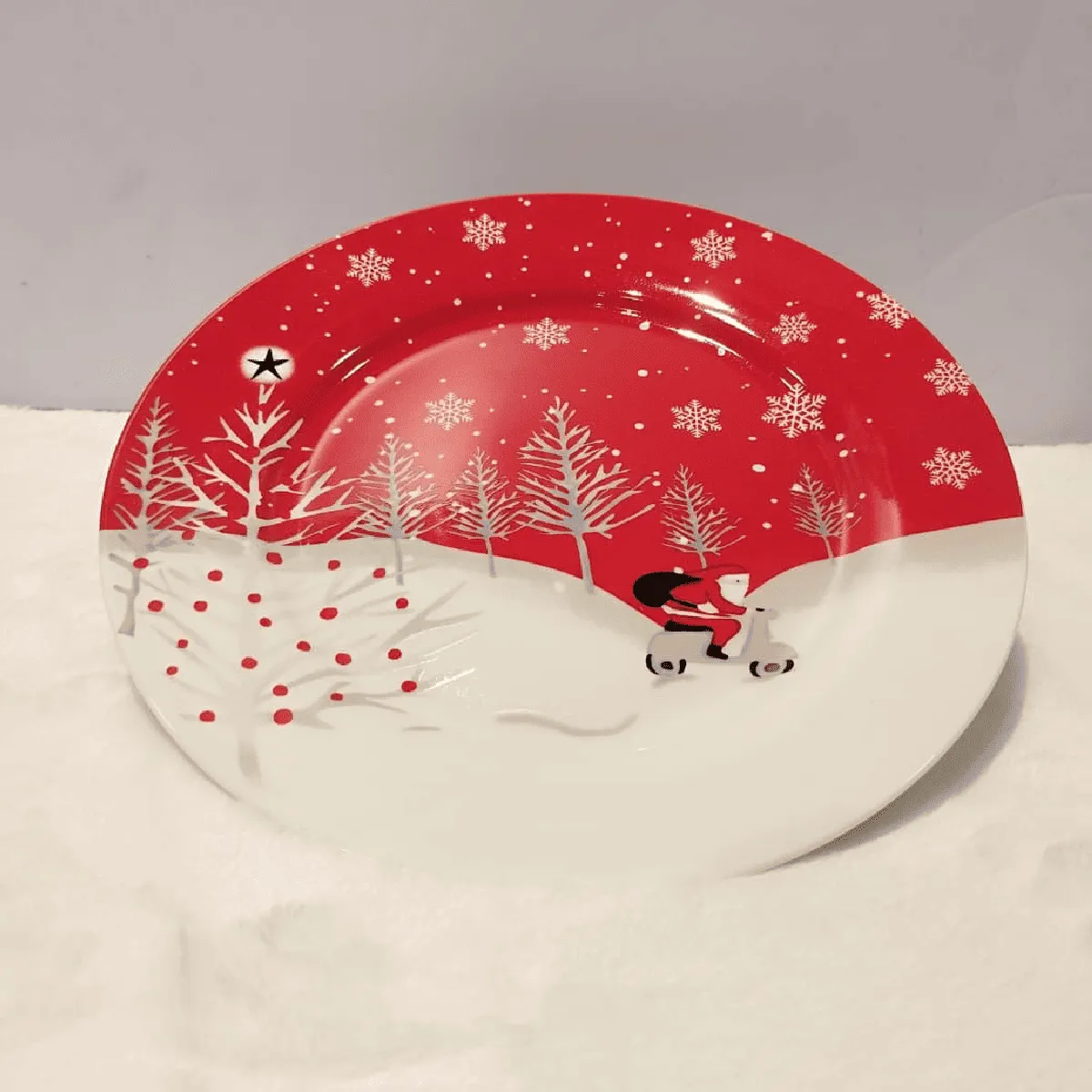 Whimsical Christmas plate featuring a snowy scene.